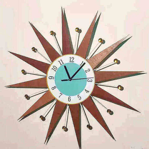 Sunburst Atomic Age Wall Clock illustrating Atomic Age Clocks and other design concepts with vintage style and colors.