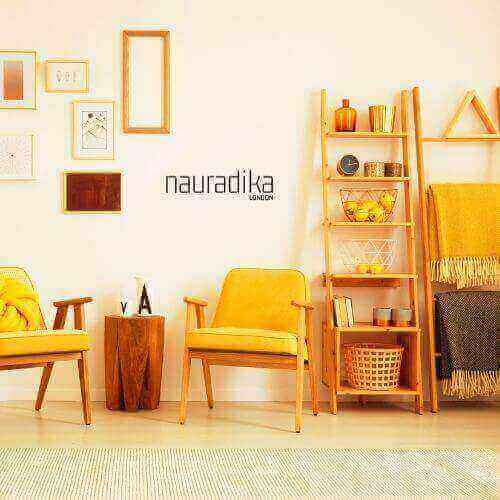Stylish living room using yellow in interior design with chairs and decor