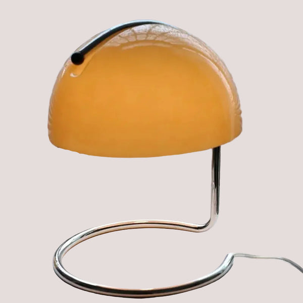 80s USB desk lamp in various colours featuring a chrome base and a tinted glass shade in yellow.