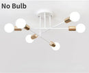 Mad Men Inspired Ceiling Lights with a modern design, featuring six white globe fixtures without bulbs.