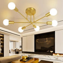 Mad Men Inspired Ceiling Lights in a modern living room with retro design and gold finish.