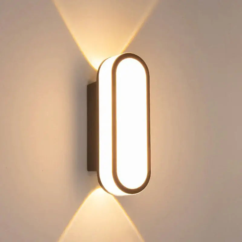 Aluminum Outdoor Modern Nordic Dimmable Wall Lamp illuminating a wall with sleek design and warm light.
