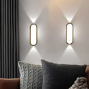Aluminum Outdoor Modern Nordic Dimmable Wall Lamp illuminating a cozy living room setting with stylish decor.