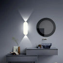 Aluminum Outdoor Modern Nordic Dimmable Wall Lamp illuminating a stylish interior with oval design.