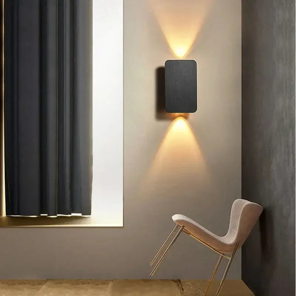 Brushed Gold/Black Double Head Wall Light illuminating a modern interior with stylish lighting.