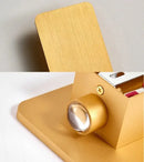 Brushed Gold/Black Double Head Wall Light showing brushed gold finish and light fixture detail.