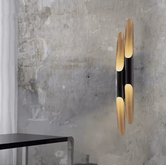 Nordic Glow Tubular Sconce showcasing a chic design with black and gold accents, perfect for elegant home decor.