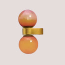Chic Dual Bubble Wall Light - Modern & Versatile Lighting with colorful globes and polished brass details.