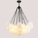Contemporary Frosted Glass Ball & Gold Chain Chandelier with frosted glass balls and black cables.