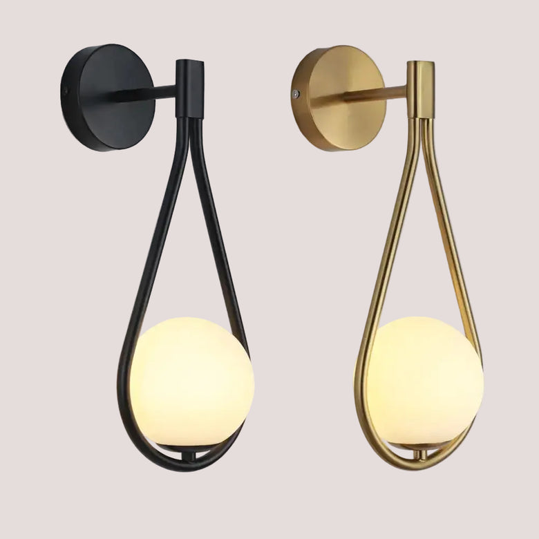 Drop Luxury Glass Ball Wall lamp in black and gold finishes, featuring a minimalist design and soft illumination.