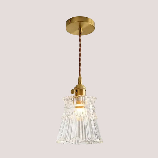 Elegant Glass Pendant Light with Brass Accents - Illuminate with Style featuring a beautiful clear glass shade.