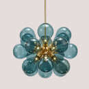 Glorious Tinted Glass Bubble Chandelier with multi-colored glass bulbs and elegant gold accents.