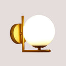 Gold Wall Light with a white glass ball and sleek golden structure, perfect for modern interiors.