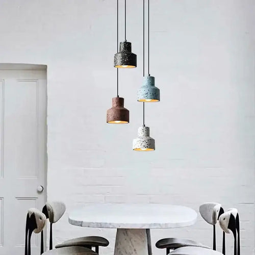 Contemporary Hanging Lights with colorful shades illuminating a stylish dining area.