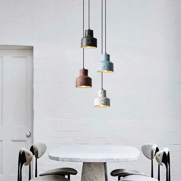 Contemporary Hanging Lights with colorful shades illuminating a stylish dining area.