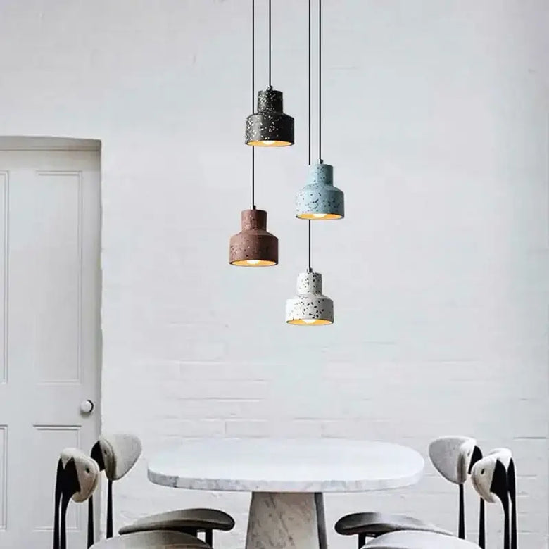 Contemporary Hanging Lights with colorful shades illuminating a stylish dining area.