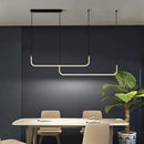 Modern Minimalist Kitchen Island Lighting - Black & Gold Options featuring a sleek design above a dining table.