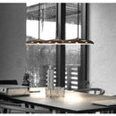 Minimalist Metal Hanging Lamp stylishly illuminating a modern dining table with a contemporary design.