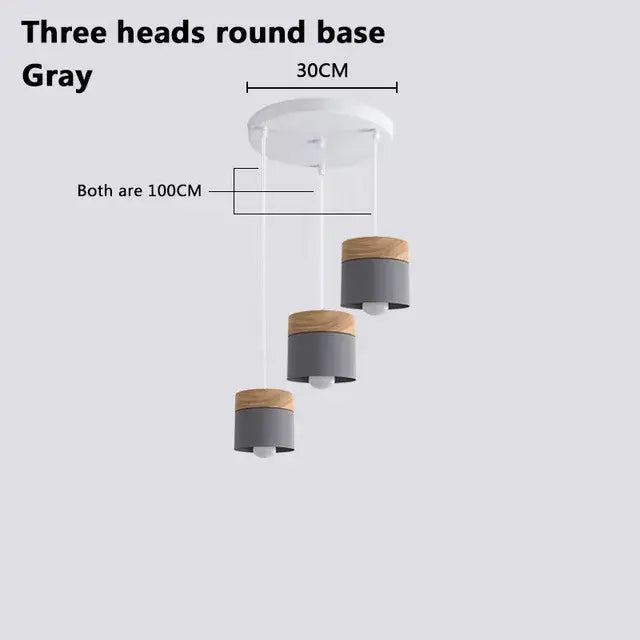 Simple Metal Danish Pendant with Wood: Three head round base in gray with wood accents for modern interiors.