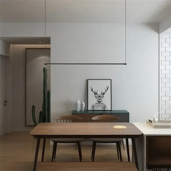 Super Simple Line Lighting | Modern LED Pendant Lamp in a minimalist dining room setting with natural elements.