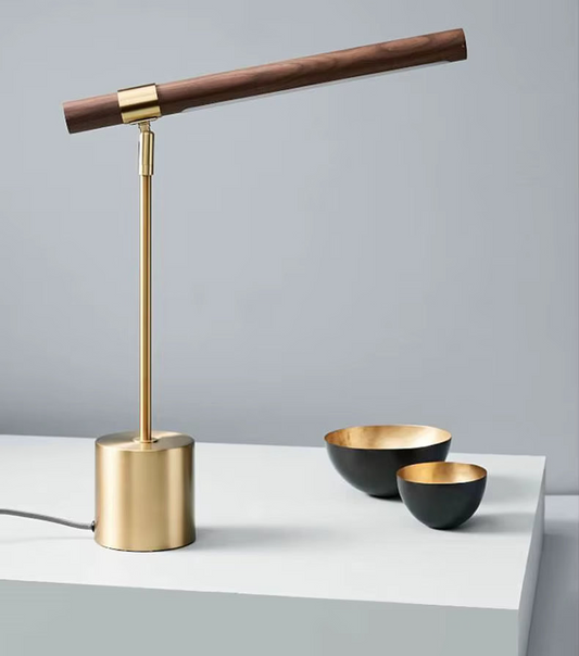 Hero Modern Wood desk lamp with wooden and brass accents on a gray surface.