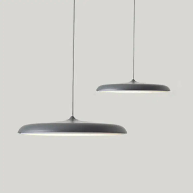 Minimalist Metal Hanging Lamp in contemporary gray design, featuring sleek lines and elegant illumination.