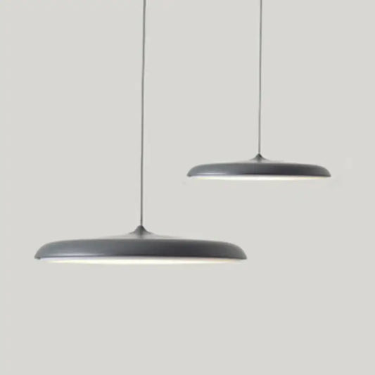 Minimalist Metal Hanging Lamp in contemporary gray design, featuring sleek lines and elegant illumination.