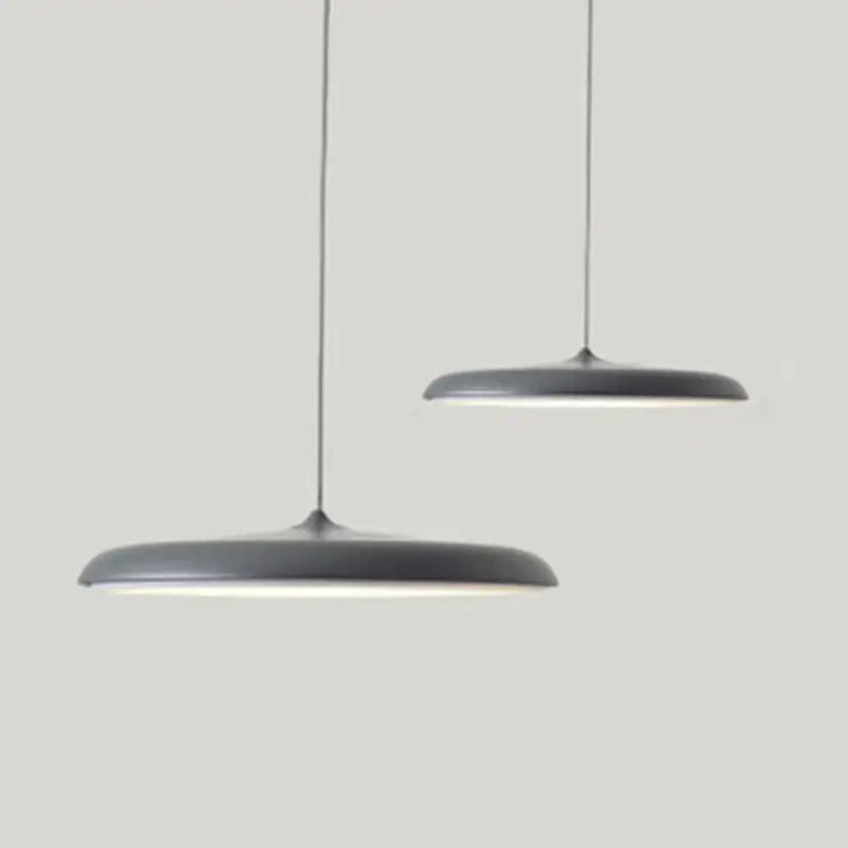Minimalist Metal Hanging Lamp in contemporary gray design, featuring sleek lines and elegant illumination.