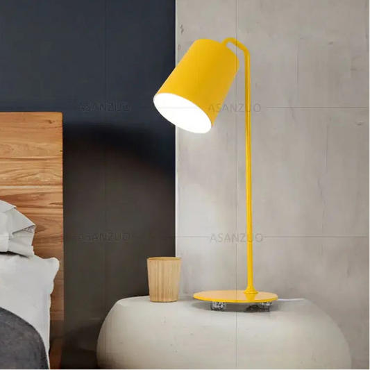 Metal Desk Lamp in Yellow with modern design on a bedside table, enhancing minimalist decor.