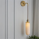 Timeless Elegance: Nordic White Porcelain Wall Lamp showcasing a modern design with a gold mount and soft ambient light.