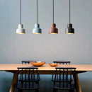 Contemporary Hanging Lights featuring modern Nordic design with colorful lampshades over a dining table.
