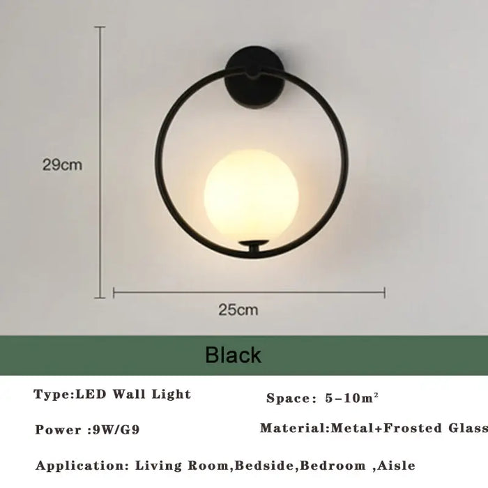 Art Deco Golden Circle Sconce in black finish with LED lighting, ideal for living room or bedside application.