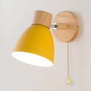 Modern Sconce With Switch, yellow shade wall-mounted light fixture with wooden base and pull chain.