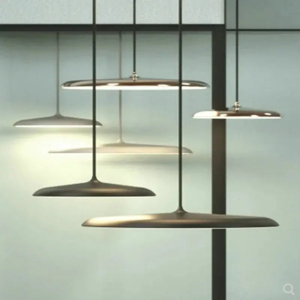 Minimalist Metal Hanging Lamp in contemporary setting with luxurious brass accents and sleek design.