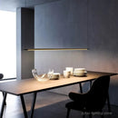 Super Simple Line Lighting | Modern LED Pendant Lamp illuminating a sleek dining table setting.