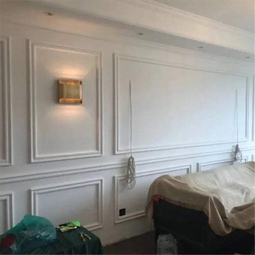 Exquisite Lobby Copper Luxury Wall Lamp! mounted on elegant white wall paneling in modern interior design.