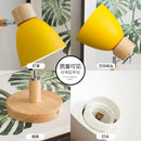 Modern Sconce With Switch in yellow with wooden base and adjustable head for versatile lighting.