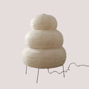 Japanese White Rice Paper Table Lamp with a unique, layered design, providing warm, diffuse lighting for any space.