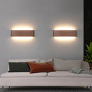 Modern Brushed Gold & Coffee LED Wall Lamp – Sleek Indoor Accent Lighting above a stylish sofa in a contemporary living room.