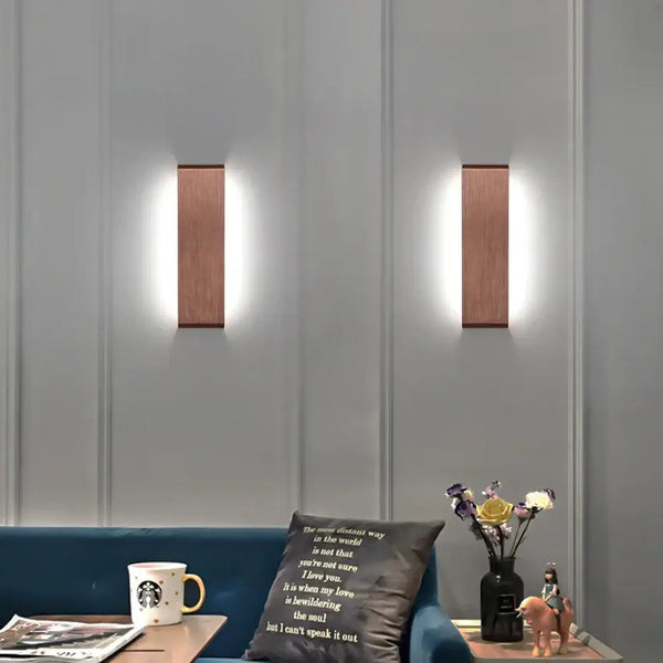Modern Brushed Gold & Coffee LED Wall Lamp – Sleek Indoor Accent Lighting illuminating a stylish living room.