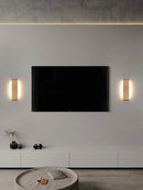 Modern Brushed Gold & Coffee LED Wall Lamp – Sleek Indoor Accent Lighting in a contemporary living room setting.