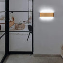 Modern Brushed Gold & Coffee LED Wall Lamp – Sleek Indoor Accent Lighting illuminating a stylish interior wall.
