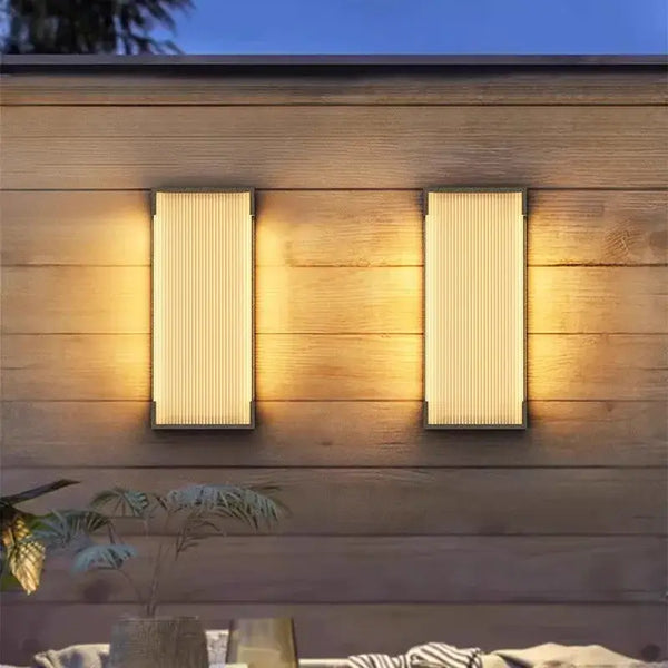 Modern Outdoor Waterproof Stainless Steel Wall Light – Warm & Cool White illuminating a wooden wall.