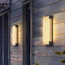 Modern Outdoor Waterproof Stainless Steel Wall Light – Warm & Cool White illuminating an exterior wall.