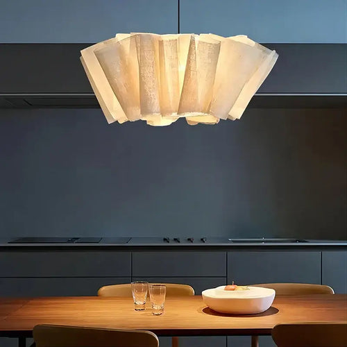 Off-White Pendant Light made from Natural Plant Fiber illuminating a stylish dining area.