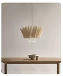 Off-White Pendant Light made from Natural Plant Fiber illuminating a dining table with soft elegance.