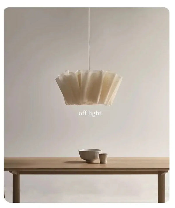 Off-White Pendant Light made from Natural Plant Fiber illuminating a dining table with soft elegance.