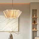 Off-White Pendant Light made from Natural Plant Fiber illuminated in a cozy, elegant interior setting.