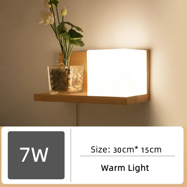 Wood and Frosted Glass Japanese Minimalist Sconces with warm light and plant integration on wall shelf.