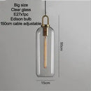 Grey Frosted Sphere Glass Hanging Lamp with clear glass, Edison bulb, and adjustable cable.